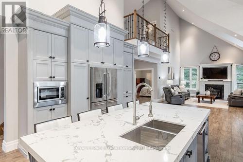 119 Wendake Road, Tiny, ON - Indoor Photo Showing Kitchen With Fireplace With Double Sink