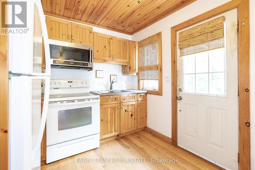 774 Lafontaine Road W, Tiny, ON - Indoor Photo Showing Kitchen With Double Sink