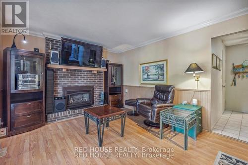 12 The Cedars Street, St. Catharines, ON - Indoor Photo Showing Living Room With Fireplace