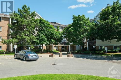 Upon arriving at the building you will note it is clean and tidy. - 260 Brittany Drive Unit#103, Ottawa, ON - Outdoor