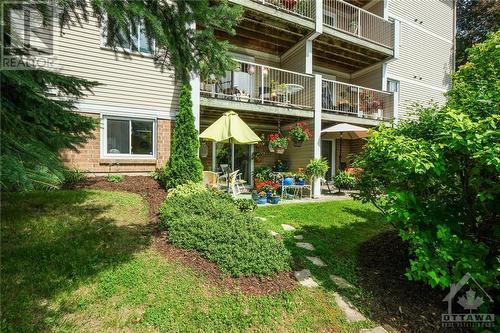 Enjoy the afternoon sun on the West facing patio. - 260 Brittany Drive Unit#103, Ottawa, ON - Outdoor