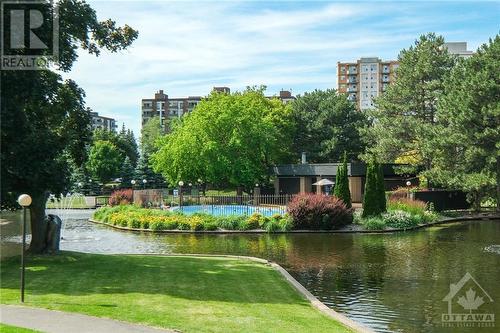 Outdoor pool with change area. - 260 Brittany Drive Unit#103, Ottawa, ON - Outdoor With Body Of Water