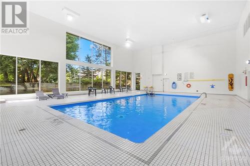 Indoor salt water pool. - 260 Brittany Drive Unit#103, Ottawa, ON - Indoor Photo Showing Other Room With In Ground Pool