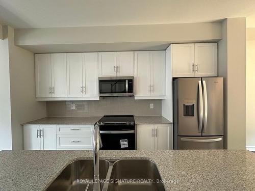 23 Folcroft St, Brampton, ON - Indoor Photo Showing Kitchen With Double Sink