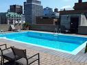 Piscine - 505-3455 Rue Drummond, Montréal (Ville-Marie), QC  - Outdoor With In Ground Pool With Deck Patio Veranda 