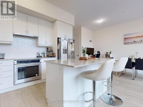 116 - 3200 William Coltson Avenue, Oakville, ON - Indoor Photo Showing Kitchen With Stainless Steel Kitchen With Upgraded Kitchen