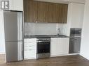 329 - 50 Upper Mall Way, Vaughan, ON  - Indoor Photo Showing Kitchen With Stainless Steel Kitchen 