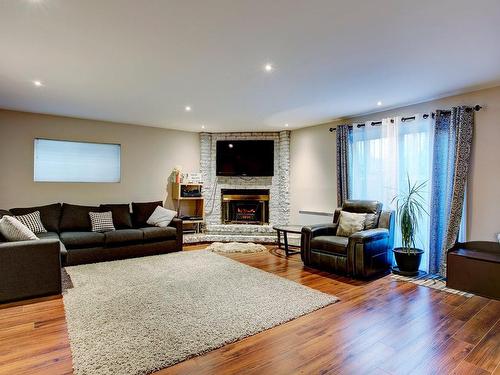 Basement - 2073 Rue De Messine, Laval (Vimont), QC - Indoor Photo Showing Living Room With Fireplace