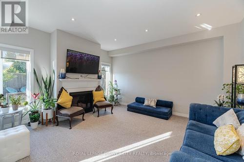 63 Goodall Court, Centre Wellington (Fergus), ON - Indoor Photo Showing Living Room With Fireplace