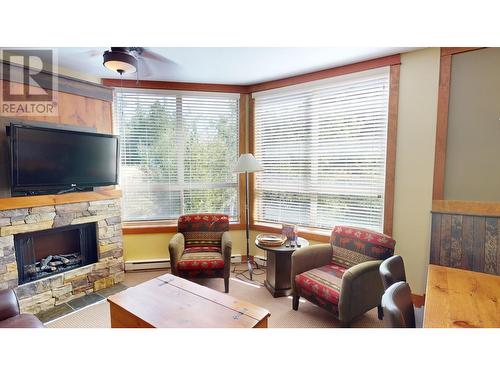 4559 Timberline Crescent Unit# 631C, Fernie, BC - Indoor Photo Showing Living Room With Fireplace