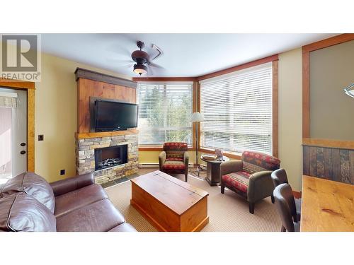 4559 Timberline Crescent Unit# 631C, Fernie, BC - Indoor Photo Showing Living Room With Fireplace