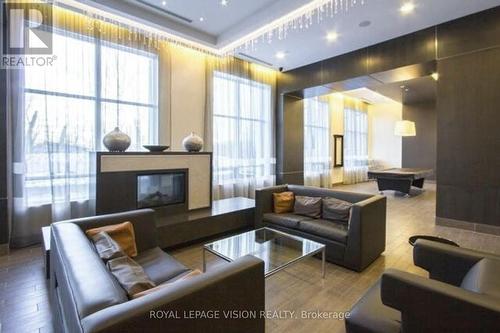 1906 - 181 Wynford Drive, Toronto (Banbury-Don Mills), ON - Indoor Photo Showing Living Room With Fireplace