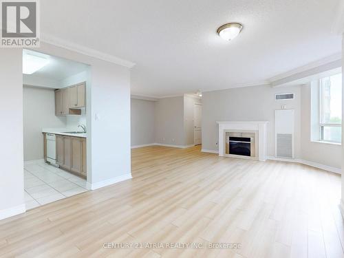 601 - 1883 Mcnicoll Avenue, Toronto (Steeles), ON - Indoor Photo Showing Living Room With Fireplace