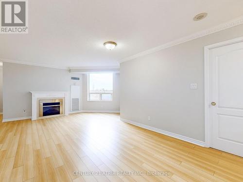 601 - 1883 Mcnicoll Avenue, Toronto (Steeles), ON - Indoor Photo Showing Living Room With Fireplace