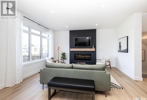 327 Aniskotaw Bend, Saskatoon, SK - Indoor Photo Showing Living Room With Fireplace