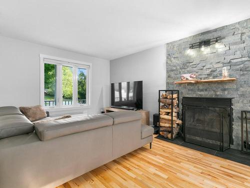 Living room - 401 Rue Du Clos-Du-Marquis, Prévost, QC - Indoor Photo Showing Living Room With Fireplace