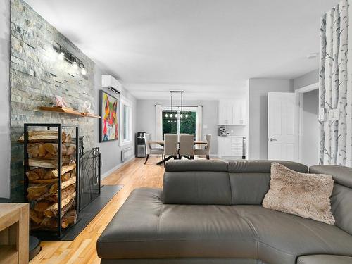 Overall view - 401 Rue Du Clos-Du-Marquis, Prévost, QC - Indoor Photo Showing Living Room With Fireplace