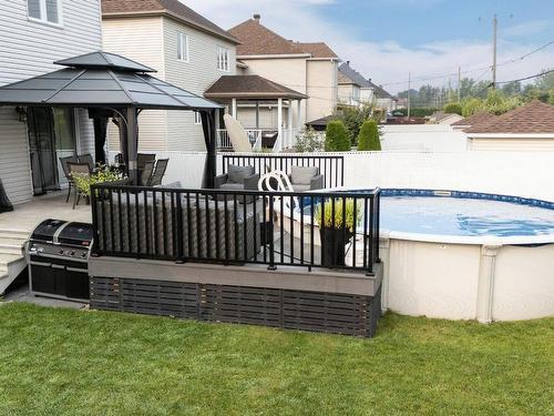 Cour - 343 Rue François-Cotineau, Terrebonne (Lachenaie), QC - Outdoor With Above Ground Pool With Deck Patio Veranda