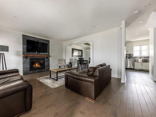 Salon - 343 Rue François-Cotineau, Terrebonne (Lachenaie), QC - Indoor Photo Showing Living Room With Fireplace