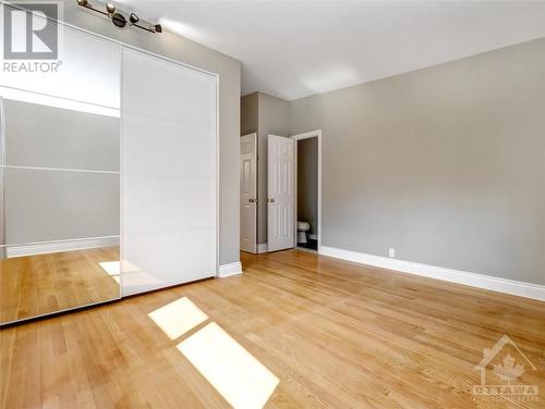 Mirrored double closet with built-ins - 4 Bowmoor Avenue, Ottawa, ON - Indoor Photo Showing Other Room