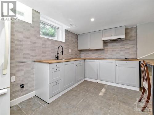 Kitchen w/cooktop, fridge and sink - 4 Bowmoor Avenue, Ottawa, ON - Indoor Photo Showing Kitchen