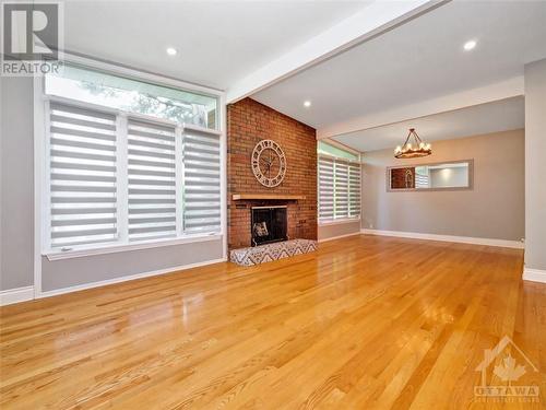 Gorgeous vaulted ceilings and hardwood floors - 4 Bowmoor Avenue, Ottawa, ON - Indoor Photo Showing Other Room With Fireplace