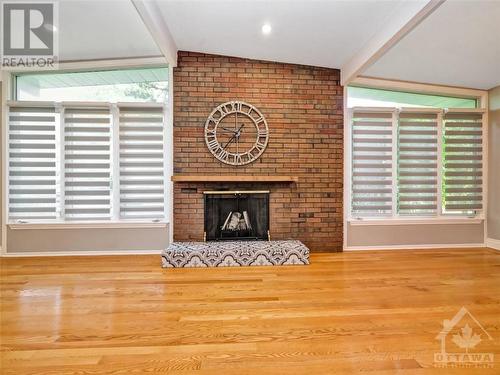 Big windows with custom blinds - 4 Bowmoor Avenue, Ottawa, ON - Indoor With Fireplace