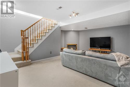 Basement Recreation Room with Gas Fireplace - 115 Braddock Private, Ottawa, ON - Indoor