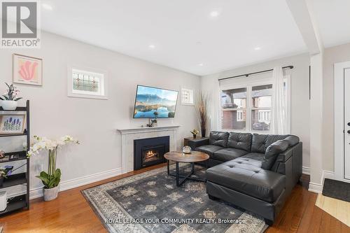 11 Denton Avenue, Toronto (Crescent Town), ON - Indoor Photo Showing Living Room With Fireplace