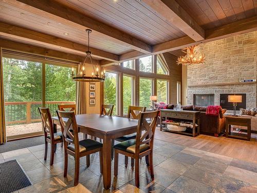 Salle Ã  manger - 130 Rue Allen, Morin-Heights, QC - Indoor Photo Showing Dining Room With Fireplace