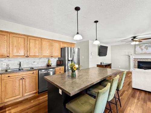 1913 Granite Ave, Merritt, BC - Indoor Photo Showing Kitchen With Fireplace With Double Sink