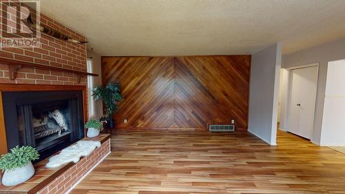 9803 Willow Road, Fort St. John, BC - Indoor Photo Showing Living Room With Fireplace