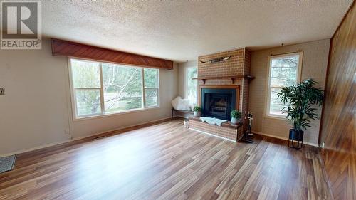 9803 Willow Road, Fort St. John, BC - Indoor Photo Showing Living Room With Fireplace