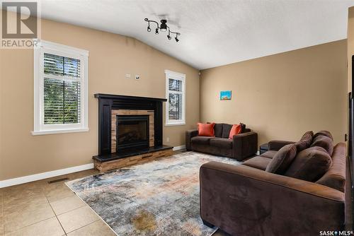 2231 Russell Place, Regina, SK - Indoor Photo Showing Living Room With Fireplace