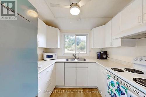 90 Plum Point Lane, Kawartha Lakes, ON - Indoor Photo Showing Kitchen With Double Sink