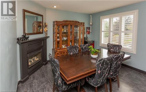 21 Heron Avenue, Woodstock, ON - Indoor Photo Showing Dining Room With Fireplace