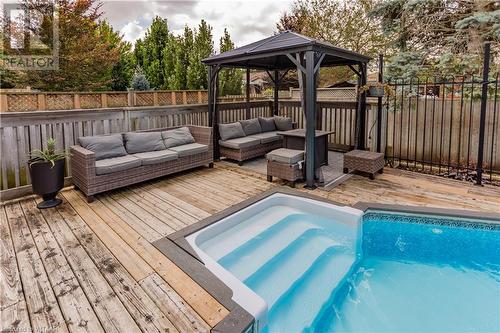 21 Heron Avenue, Woodstock, ON - Outdoor With In Ground Pool With Deck Patio Veranda With Backyard