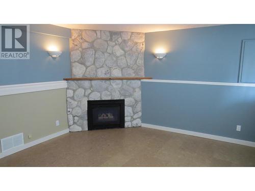 1310 Twan Avenue, Quesnel, BC - Indoor Photo Showing Living Room With Fireplace