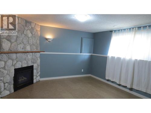 1310 Twan Avenue, Quesnel, BC - Indoor With Fireplace