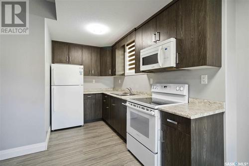 663 Kenaschuk Crescent, Saskatoon, SK - Indoor Photo Showing Kitchen With Double Sink