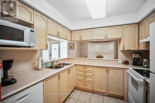 D307 - 216 Plains Road W, Burlington (Lasalle), ON - Indoor Photo Showing Kitchen With Double Sink