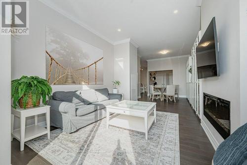 201 - 1880 Gordon Street, Guelph, ON - Indoor Photo Showing Living Room With Fireplace