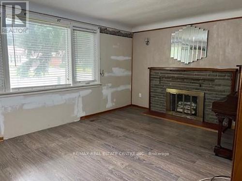 6648 Dunn Street, Niagara Falls, ON - Indoor Photo Showing Other Room With Fireplace