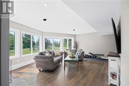 Lower Level Family Room with Wood Stove - 951 Corktown Road, Merrickville, ON - Indoor Photo Showing Living Room