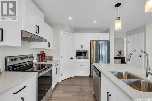 239 Asokan Street, Saskatoon, SK - Indoor Photo Showing Kitchen With Double Sink