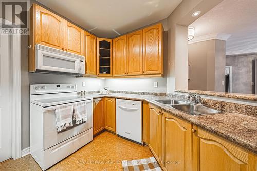 302 - 443 Centennial Forest Drive, Milton (Timberlea), ON - Indoor Photo Showing Kitchen With Double Sink