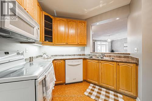 302 - 443 Centennial Forest Drive, Milton (Timberlea), ON - Indoor Photo Showing Kitchen With Double Sink