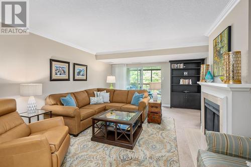 406 - 693 Windermere Road, London, ON - Indoor Photo Showing Living Room With Fireplace