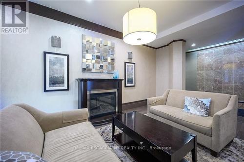 1801 - 67 Caroline Street S, Hamilton, ON - Indoor Photo Showing Living Room With Fireplace