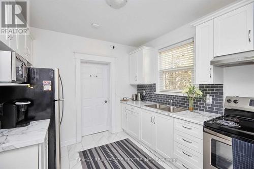 5949 Delaware Street, Niagara Falls, ON - Indoor Photo Showing Kitchen With Double Sink